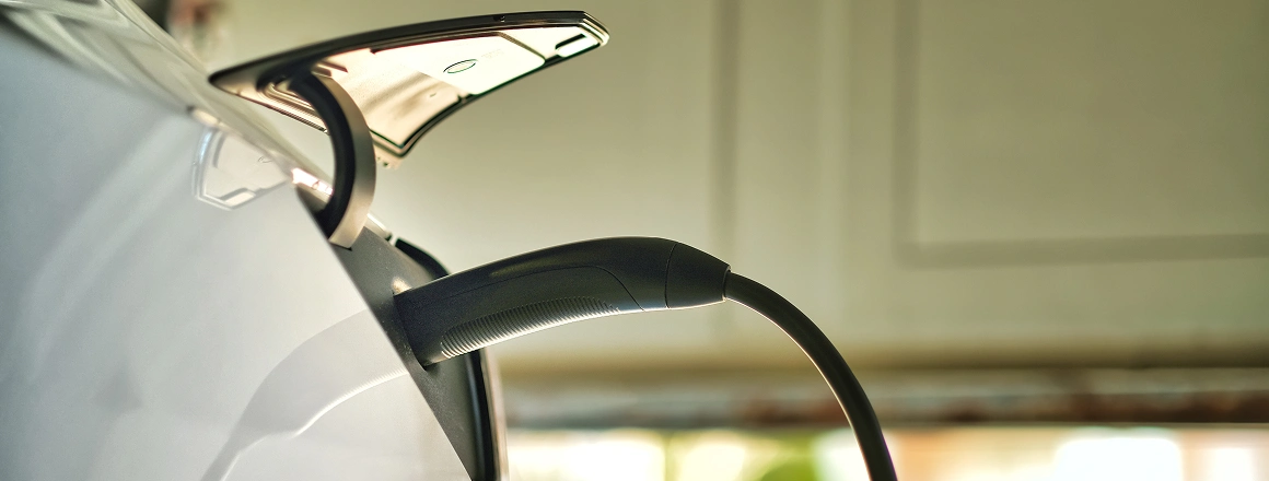 EV charging handle connected to vehicle
